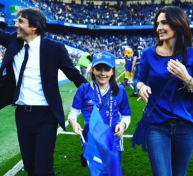 Elisabetta Muscarello with her husband Antonio Conte and daughter.